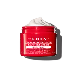 Crvena posudica kreme Kiehl’s Ultra Facial Meltdown Recovery Cream Whip, koja prikazuje vazdušastu teksturu.