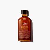 A graphic featuring a dark amber bottle of Kiehl's Ferulic Brew Facial Essence with a black cap. The label has white and yellow text that reads “200 ml".