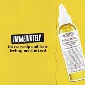 Bočica Magic Elixir Hair Oil na zlatnoj pozadini sa tekstom: „Trenutno ostavlja kožu glave i kosu hidriranim.”