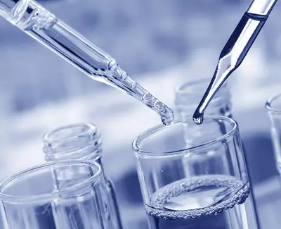 Two droppers are above glass test tubes with clear liquid, depicting a laboratory setting. The image has a blue tint.