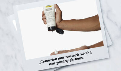 A hand pouring a non-greasy hair product into the palm, with text below that reads "Condition and smooth with a non-greasy formula."