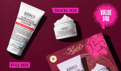 A graphic displaying a white "KIEHL'S ULTRA FACIAL BARRIER-HYDRATING CLEANSER" tube labeled "FULL SIZE" and a smaller white "KIEHL'S ULTRA FACIAL CREAM" jar labeled "TRAVEL SIZE". In the upper right, a pink splattered text box reads "VALUE $40". A partial Kiehl's gift box with a pink graphic bow is visible in the bottom right corner.
