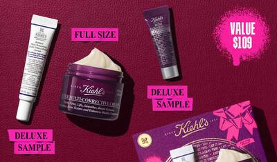 A graphic, set against a dark red textured background, features three Kiehl’s products and a gift box. A white and purple tube of "Kiehl's Retinol Skin-Renewing Daily Micro-Dose Serum" is labeled "DELUXE SAMPLE" in bright pink. A purple jar of "Kiehl's Super Multi-Corrective Cream" with visible cream is labeled "FULL SIZE" in bright pink. A small purple tube of "Kiehl's Super Multi-Corrective Eye Zone Treatment" is labeled "DELUXE SAMPLE" in bright pink. In the lower right, a purple Kiehl’s gift box showcasing the same three products is visible, decorated with bright pink graphic paint