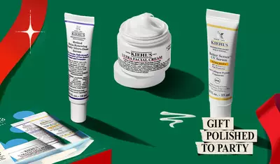 Hydrating Holiday Hits" skincare gift set on a green background, featuring Ultra Facial Cream and Creamy Eye Treatment with Avocado in festive packaging.​